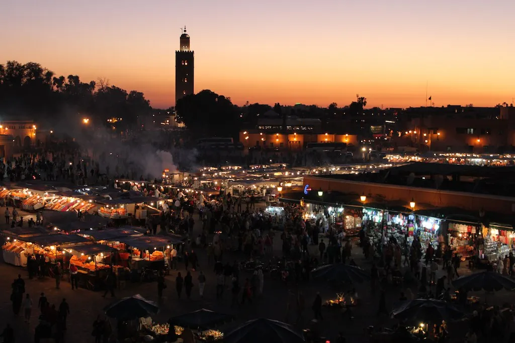 Morocco Family Itinerary: 8 Days That Work for Kids Jemaa el-Fna square at sunset with families and food stalls, Marrakech