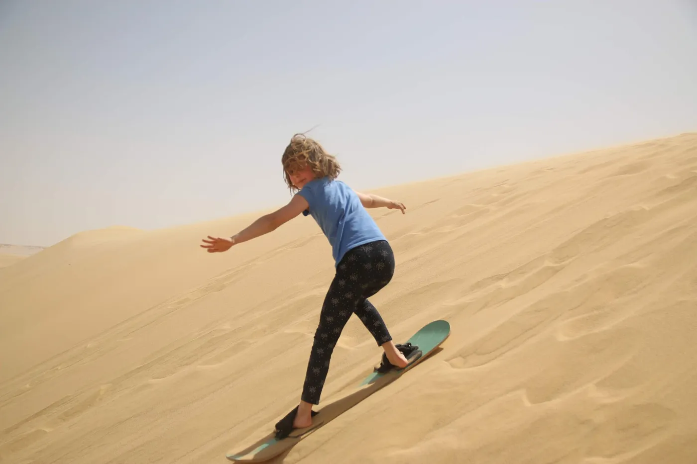 Sandboarding on the dunes.jpg Sandboarding on the dunes.jpg